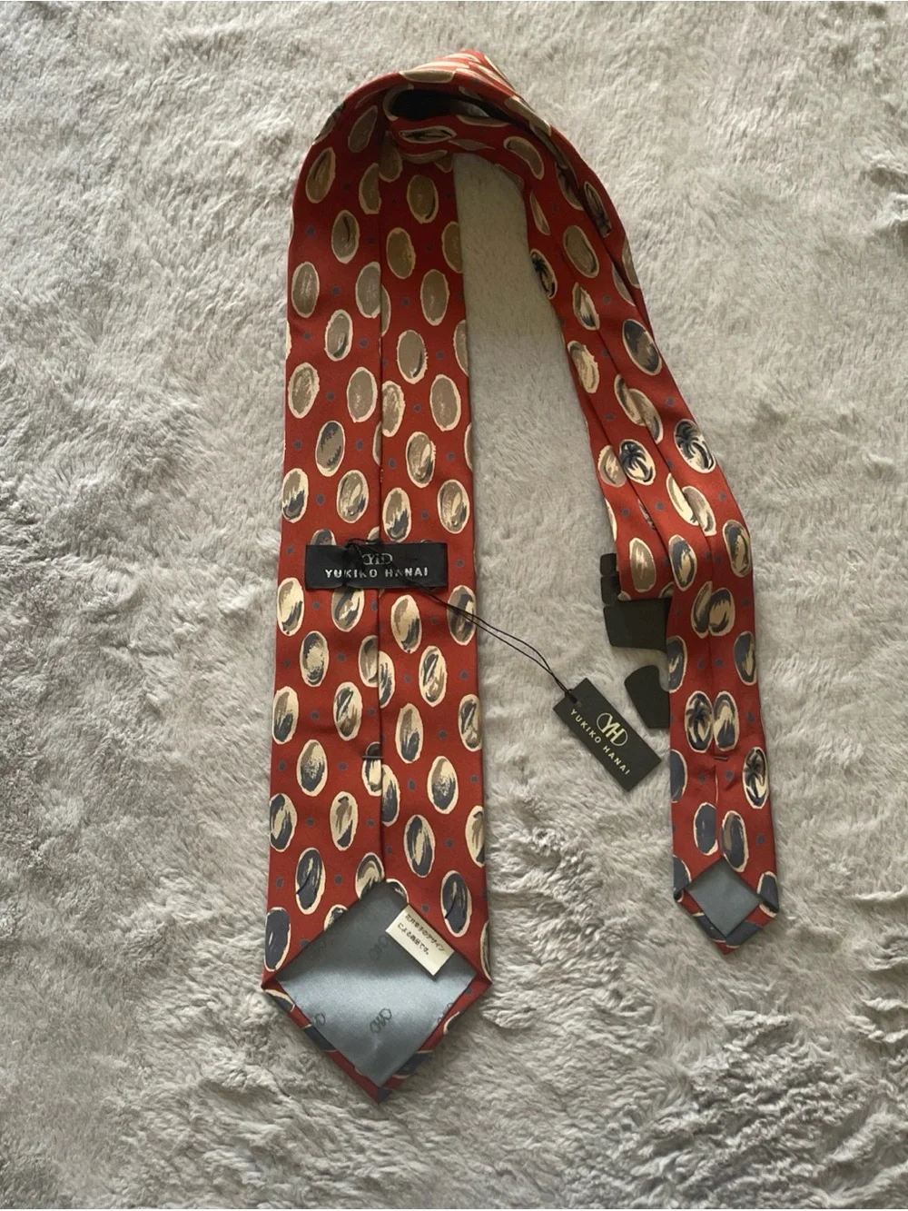 Yukiko Rust Red Silk Tie with Navy and Cream Oval Motifs